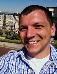 Picture of Lev smiling at the top of Lombard St. in 2013